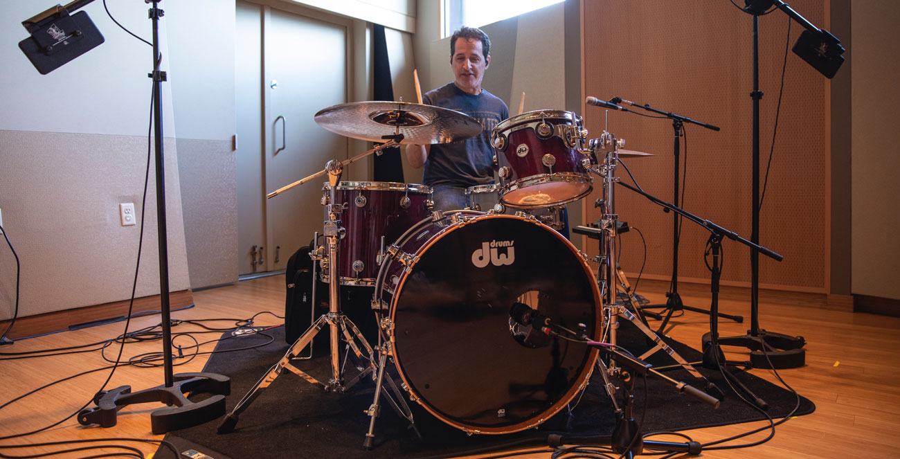 Nick D'Virgilio sitting at the DW Collector's Series drum kit in Sweetwater Studio A