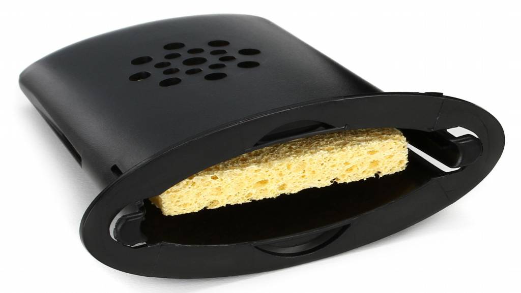 A guitar humidifier holds a sponge which you moisten with water every few days