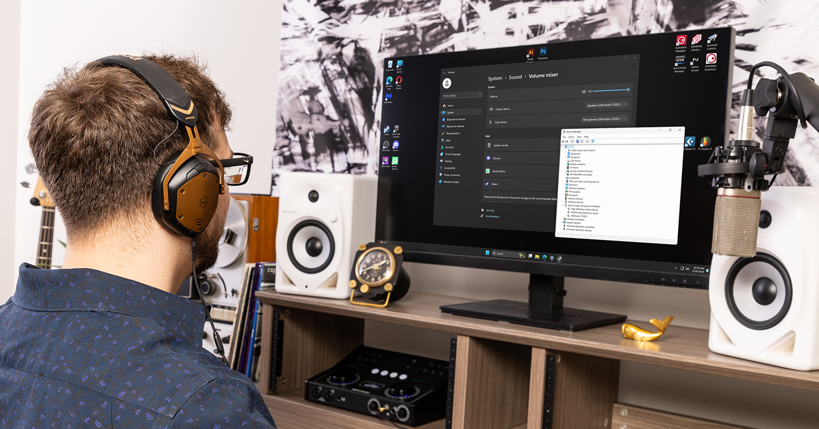 person wearing headphones using a Windows PC